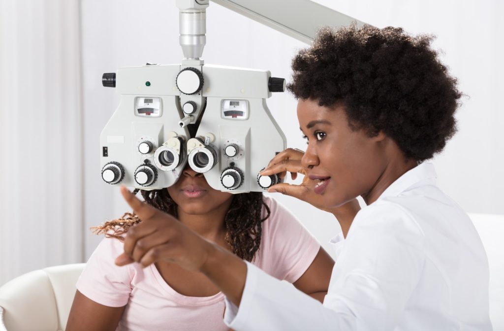 Optometrist performing and eye exam