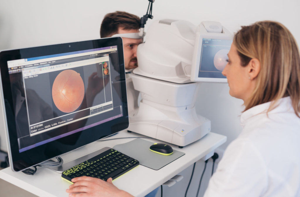 An ophthalmologist examining the optical nerves of her patient.