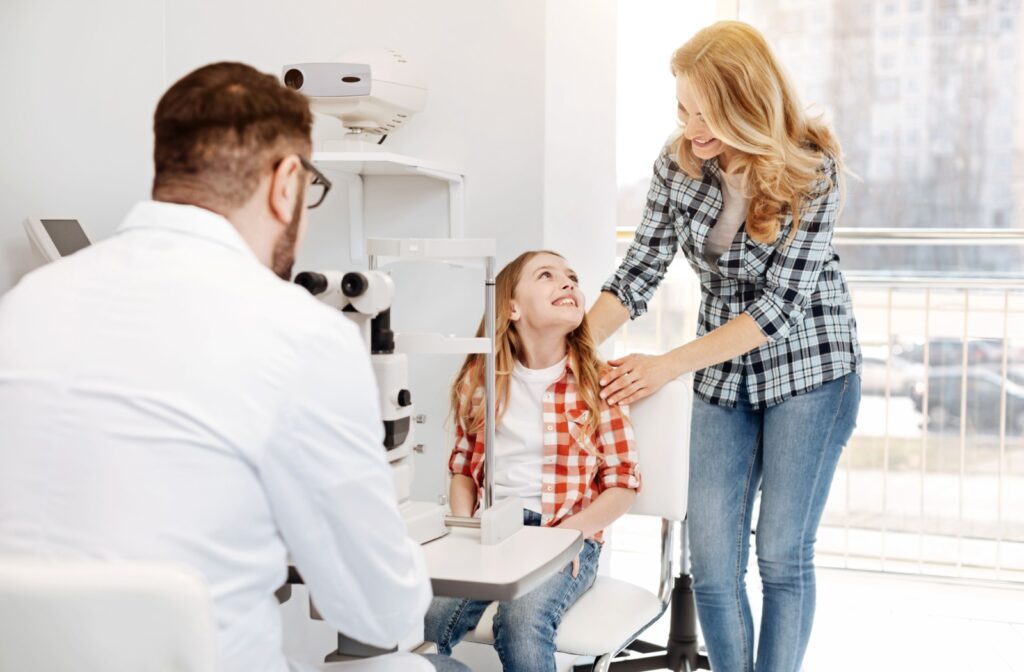 Child at the optometrist office with parent during an eye exam.